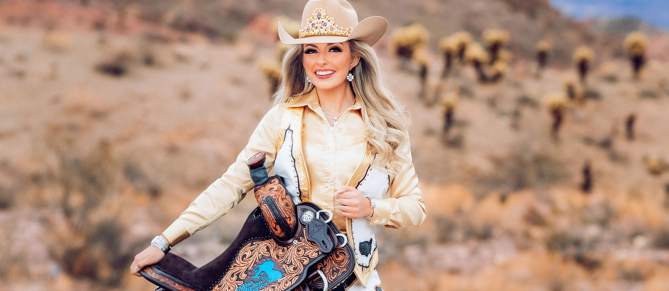 Hailey Frederiksen Holding a saddle.&nbsp;